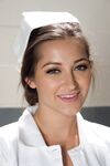 Gorgeous nurse with a nice butt Dani Daniels strips and poses in high heels