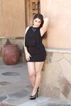 Beautiful brunette babe Valentina Nappi strips naked to toy trimmed pussy