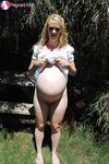Amateur girl Hydii May parts her teen pussy after revealing pregnant belly