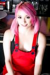 Petite white girl with pink hair pets her hairless pussy in the nude