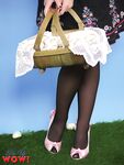 Beautiful woman in short skirt & silk lingerie strips in vintage pinup porn