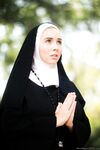 Thick Nun exposes herself in the courtyard wearing over the knee socks