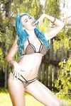 Blue haired babe Gigi Allens freeing big tits from bikini top beside pool