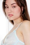 Petite brunette Sasha Grey frees tiny tits and pink twat from sheer lingerie