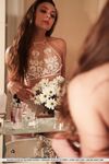Sultry teen Valery Leche gets into a petal filled tub after removing lingerie