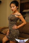 Hot Asian beauty Aria Lee bares her breasts and hikes her sexy dress