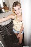 Young cutie Zoey Ryder bares her tiny tits and blows bubbles on the toilet