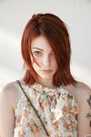 Redheaded teen Bree Daniels shows her slim body and poses in pink lingerie