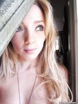 Ally Winters is spreading her slim legs wide open while masturbating