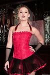 Winning redhead Dani Jensen showing off her red corset & sexy high top boots