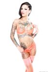 Tattooed stockings clad Bonnie Rotten in heels & hot underwear showing nipples
