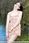 Brunette babe shedding summer dress outdoors for teen glamour photos