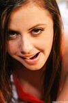 Beautiful petite babe shows off her lovely teen tits while topless