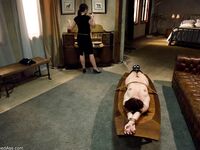 Femdom Penny Flame toys with a vibrator while sitting on a face strapon