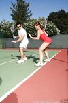 Sexy Penny Flame entices with ass & cleavage in tight dress on a tennis court