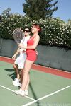 Sexy Penny Flame entices with ass & cleavage in tight dress on a tennis court