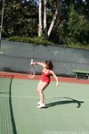 Sexy Penny Flame entices with ass & cleavage in tight dress on a tennis court