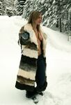 Three big boobed stunners pose braless in their fur coats in the snow