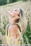 Slim blonde babe Taylor undresses and spreads her twat outdoors