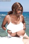Enormously busty ebony Miosotis looses her amazing breasts for a beach bang