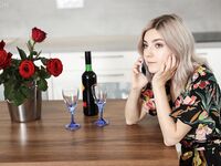 Amateur girl Eva Elfie gets totally naked after drinking wine at kitchen table