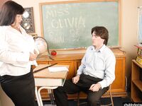 Mature BBW schoolteacher Olivia giving a blowjob in classroom