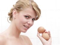 Solo girl Katalin Kiraly cracks an egg while taking a shower