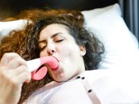 Curly haired amateur MILF Lili fingering and dildoing her bald snatch