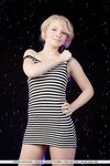 Smiley faced teen Feeona A revealing toned body parts in the nude