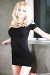 Clothed babe blonde Riley Steele is slowly showing her ass!
