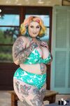 Inked BBW with rainbow hair Galda Lou exposes her huge melons and big butt