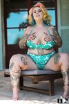 Inked BBW with rainbow hair Galda Lou exposes her huge melons and big butt