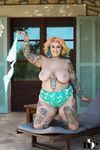 Inked BBW with rainbow hair Galda Lou exposes her huge melons and big butt
