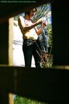 Hidden voyeur spies on naked girl getting dressed outdoors