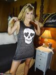 Petite MILF Jolene Devil moans with pleasure as she masturbates on the sofa