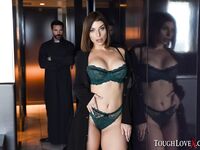 Brunette chick covers up her naked boobs in front of a Priest