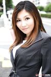 Attractive Japanese MILF Yuria Kanno posing in public in her sexy uniform