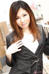 Attractive Japanese MILF Yuria Kanno posing in public in her sexy uniform