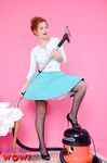 Redhead female Elle Richie removes her clothing with help from vacuum cleaner