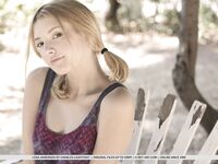 Teen first timer Lena Anderson vaunts her lithe body under a tree outside