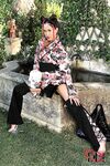 Asian babe in pigtails bares nice ass for anal masturbation outdoors