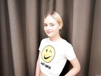 Adorable blonde teen Emily Cutie touts her phat ass and pink slit in the nude