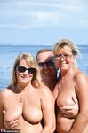 Chubby naked Sweet Susi indulging doggystyle in sizzling beach threesome