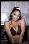 Black MILF Carmen Hayes pleases two cocks at the same time with oral sex
