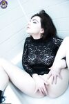 Pale girl with dark hair Nicotine fingers her naked pussy in a bathtub