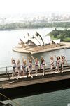 Busty Playboy centerfolds enjoy warming their big tits in the Australian sun