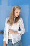 Amateur teen Jane Franklin posing in her white shirt and tight jeans outdoors