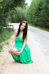 Naughty brunette Evita Lima flashes a naked upskirt then strips in the roadway