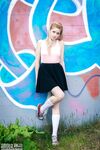 Fair skinned amateur Margarita shows her tits and twat in front of graffiti