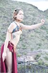 Skinny babe in Princess Leia costume Natalie rubs her clam outdoors